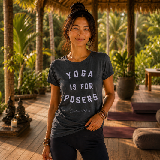 Woman wearing a Spiritual Drifter t-shirt with 'Yoga is for Posers' text in a tropical setting at a luxury retreat center n Bali Indonesia.