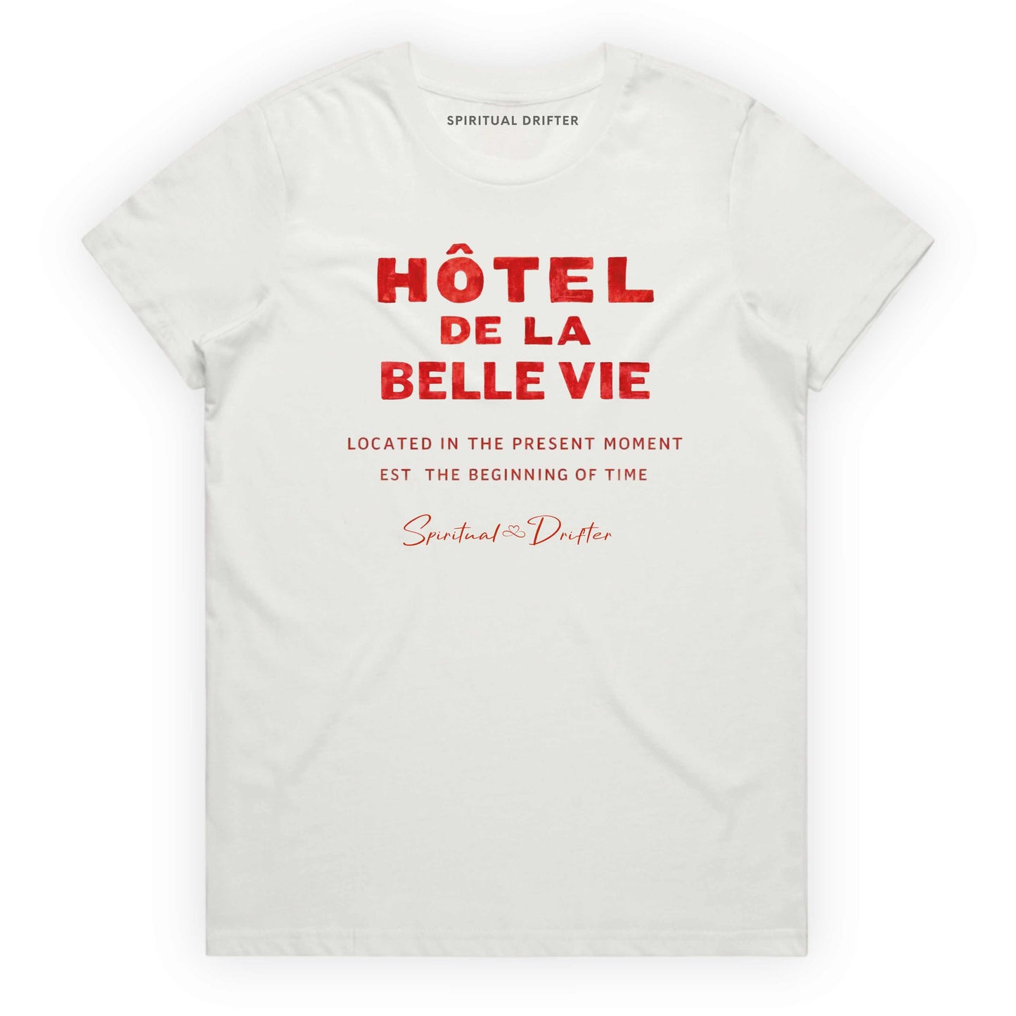 White Spiritual Drifter t-shirt with red text 'Hôtel de la Belle Vie' on a white background. Conscious clothing for awakened souls.