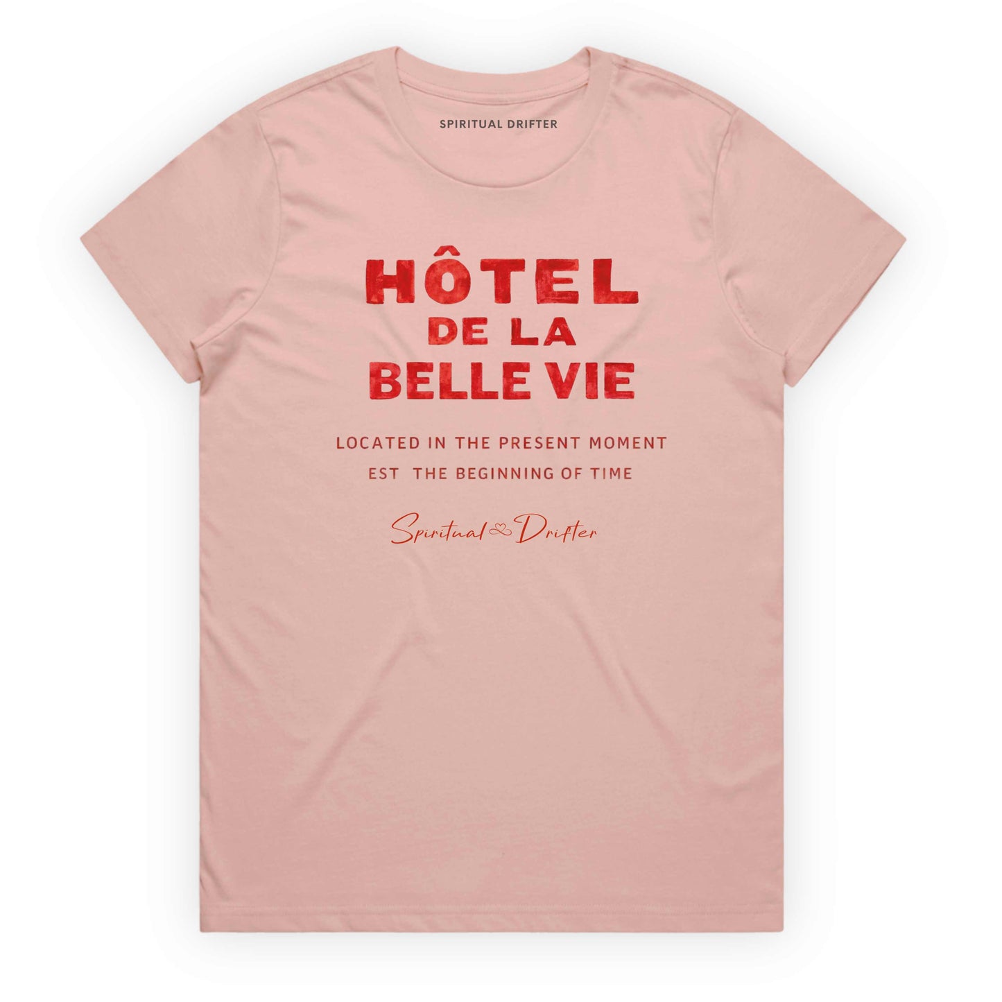 Soft Pink Spiritual Drifter t-shirt with red text 'Hôtel de la Belle Vie' on a white background. Conscious clothing for awakened souls.