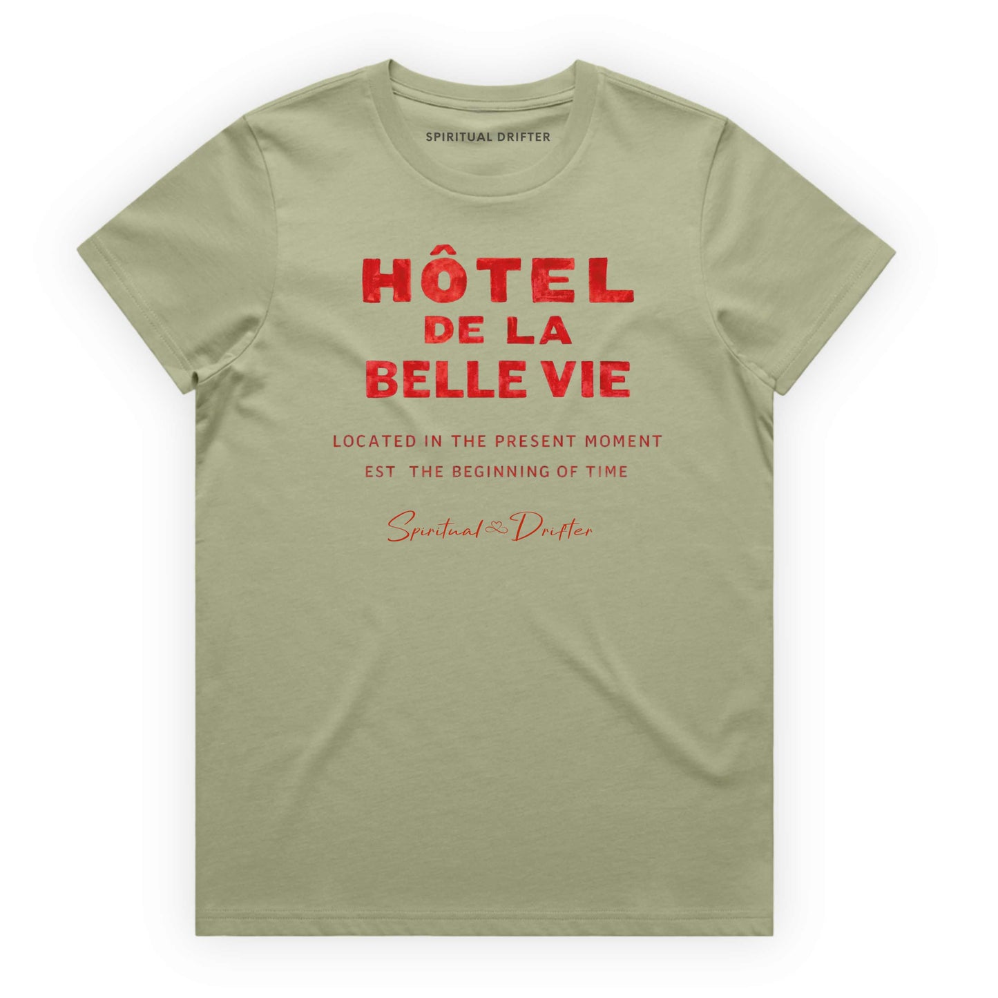 Pistachio Green Spiritual Drifter t-shirt with red text 'Hôtel de la Belle Vie' on a white background. Conscious clothing for awakened souls.