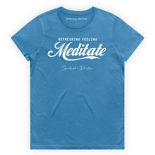 Hydro blue t-shirt with graphic text 'Meditate' on a white background. Elevated spiritual apparel inspired by awakening, meditation, mindfulness, yoga, law of attraction and conscious living.