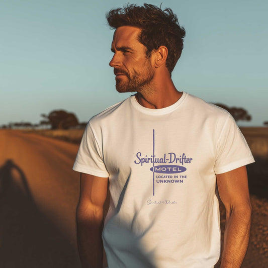 male model wearing white spiritual drifter motel located in the unknown unisex organic cotton t-shirt, vintage motel graphic tee, minimalist travel inspired clothing, outdoor lifestyle apparel