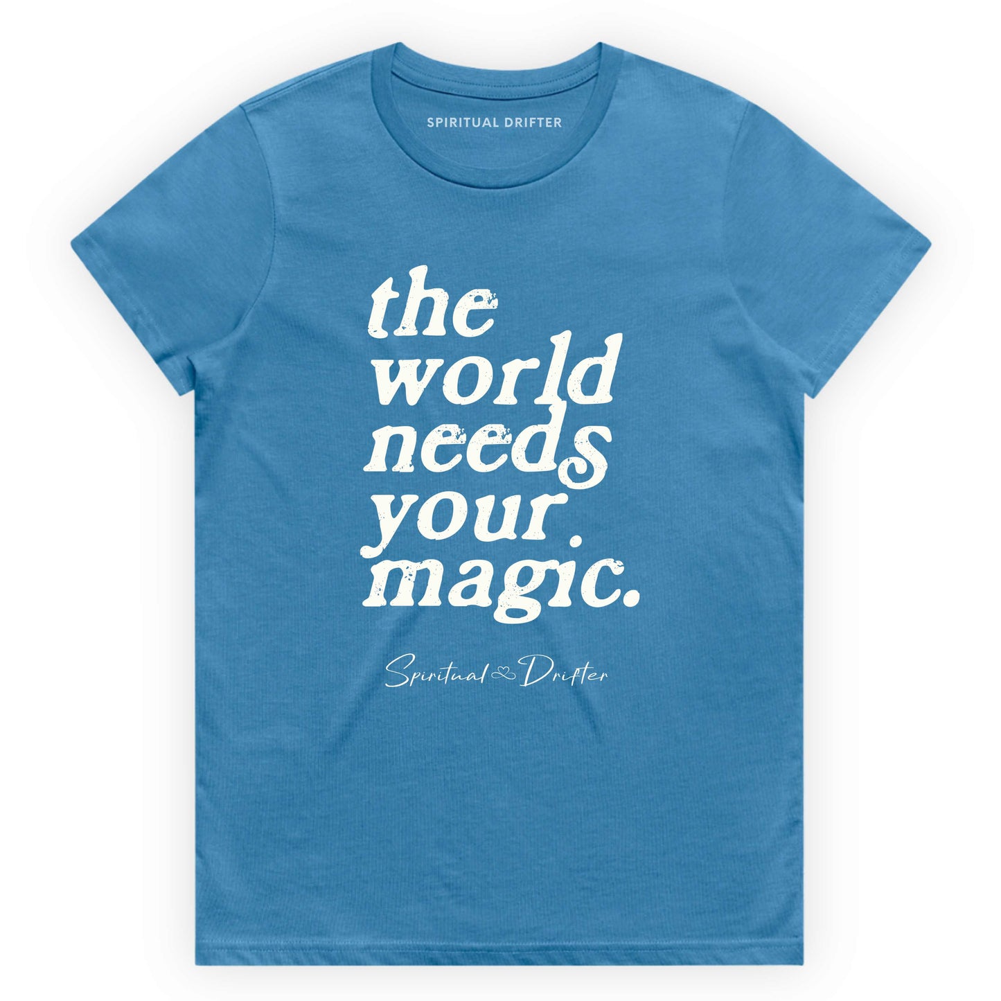Blue Spiritual Drifter t-shirt with 'the world needs your magic' text on a white background. Spiritual lifestyle infinite yoga apparel, positive vibes, conscious aware, healthy lifestyle living clothing.background