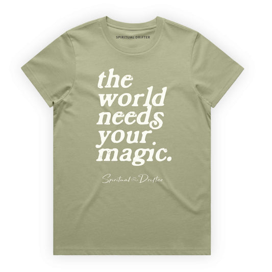 Pistachio Green Spiritual Drifter t-shirt with 'the world needs your magic' text on a white background. Spiritual lifestyle infinite yoga apparel, positive vibes, conscious aware, healthy lifestyle living clothing.