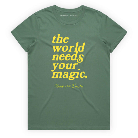 Green sage Spiritual Drifter t-shirt with 'the world needs your magic' text on a white background. Spiritual lifestyle infinite yoga apparel, positive vibes, conscious aware, healthy lifestyle living clothing.background
